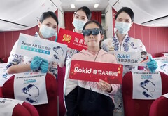 Hainan Airlines passengers enjoy virtual entertainment while wearing Rokid Max AR glasses during Lunar New Year flights. (Source: Rokid)