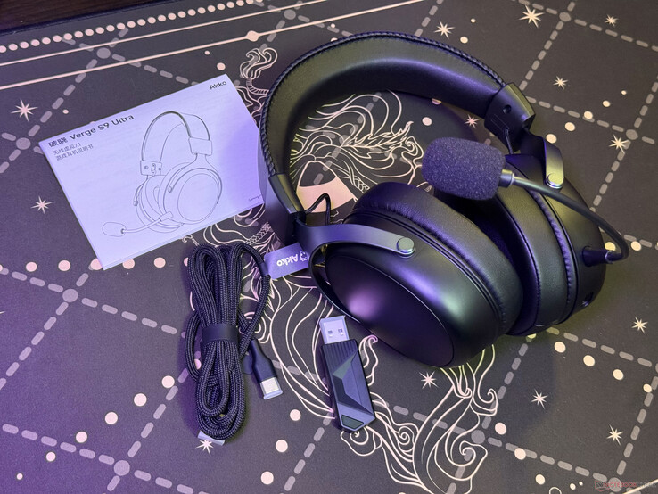 The headphones come with an USB-C cable, a wireless receiver dongle, and a manual