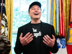 Elon Musk speaking in the White House Oval Office. (Image source: ALLISON ROBBERT/AFP via Getty Images)