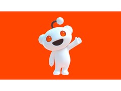 A promotional image for Reddit&#039;s mascot, Snoo, waving to the viewer and posing against a red background. (Image Source: Reddit)