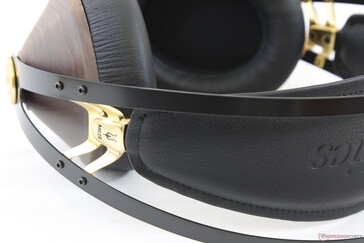 The inner faux-leather headband will automatically adjust up or down and can be removed with a Philips screwdriver if needed