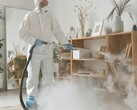 A woman steam-cleaning her house. (Image source: Michelangelo Buonarroti - Pexels)