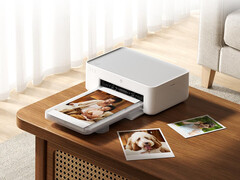The new Desktop Photo Printer 2 costs around $103 on Youpin. Pictured: A promo picture showing the printer in action.