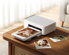 The new Desktop Photo Printer 2 costs around $103 on Youpin. Pictured: A promo picture showing the printer in action.