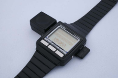 The WristMac on its &#039;bi-directional&#039; Macintosh adapter. (Image source: Aroged)