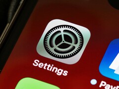 Close-up of the Settings app icon on an iPhone screen