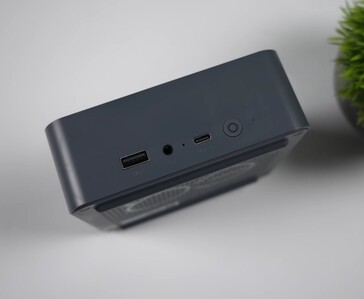 Front I/O of the Beelink EQi 304 mini PC featuring a USB Type-A port, 3.5 mm audio jack, USB-C port and power button.