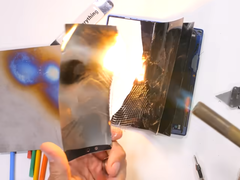 A top-end smartphone burns. (Image source: JerryRigEverything via YouTube)