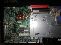Motherboard with the RAM, SSD and the CPU exposed