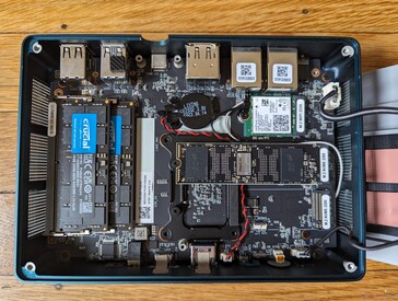 Removing the fan bracket reveals the underside of the motherboard and the upgradeable components