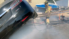 Sacramento firefighter putting out a combusting Model S (image: SFD)