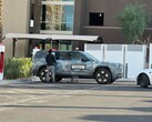 A Rivian R2 charging at a Tesla Supercharger (Image source: Chrisediting on X)