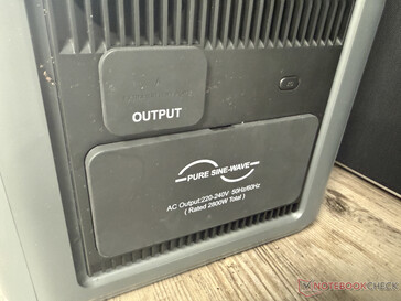 Under two protective caps on the right-hand side...