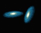 An artist's illustration showing two galaxies.