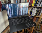 The Asus TUF Gaming A18 in front of a book shelf