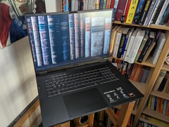 The Asus TUF Gaming A18 in front of a book shelf