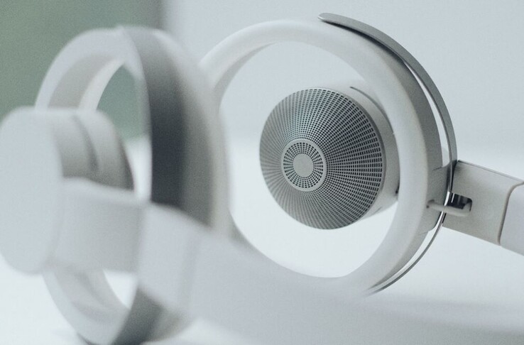 The 12 mm tweeters and 35 mm woofers are hidden behind textured steel grills. Circular earpads hold the open-ear headphones in place. (Image source: NTT Sonority)