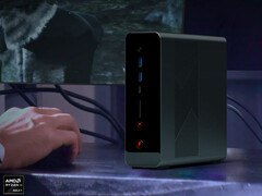 The OneXStation has launched without any formal announcements. Pictured: the mini PC on a desk next to a gaming monitor.