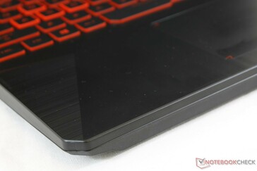 Textured plastic surfaces from top to bottom. Center of keyboard warps slightly with applied pressure