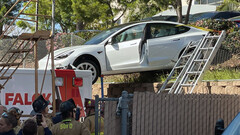 A pedal mishap sent this Tesla on top of an ambulance (image: SDFD)