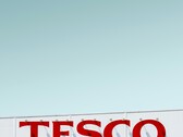 Tesco exterior signage photographed against a clear sky (Image source: Simone Hutsch via Unsplash)