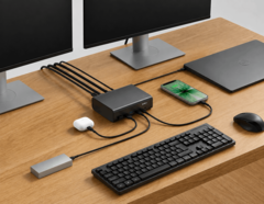 Belkin 12-in-1 dock connected to a laptop, dual monitors, and other peripherals in a desktop setup