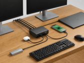 Belkin 12-in-1 dock connected to a laptop, dual monitors, and other peripherals in a desktop setup
