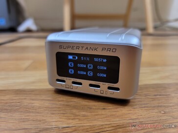 OLED display on second screen shows incoming and/or outgoing power through each of the four USB-C ports