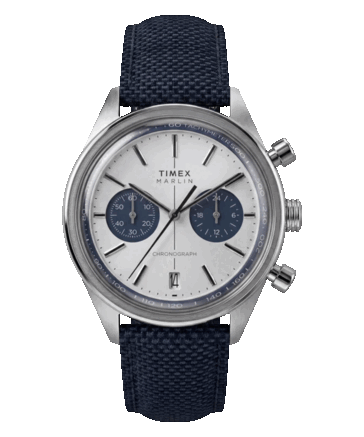Timex Marlin Jet Chronograph TW2Y89900 with a silver-white concave dial, navy chronograph subdials, date window at 6 o’clock, and navy fabric strap.