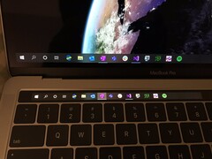 Slightly more useful? The hack puts the Windows 10 Taskbar on the TouchBar in Bootcamp, but at the cost of the function keys. (Source: Twitter @imbushuo)