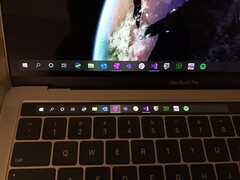 Slightly more useful? The hack puts the Windows 10 Taskbar on the TouchBar in Bootcamp, but at the cost of the function keys. (Source: Twitter @imbushuo)