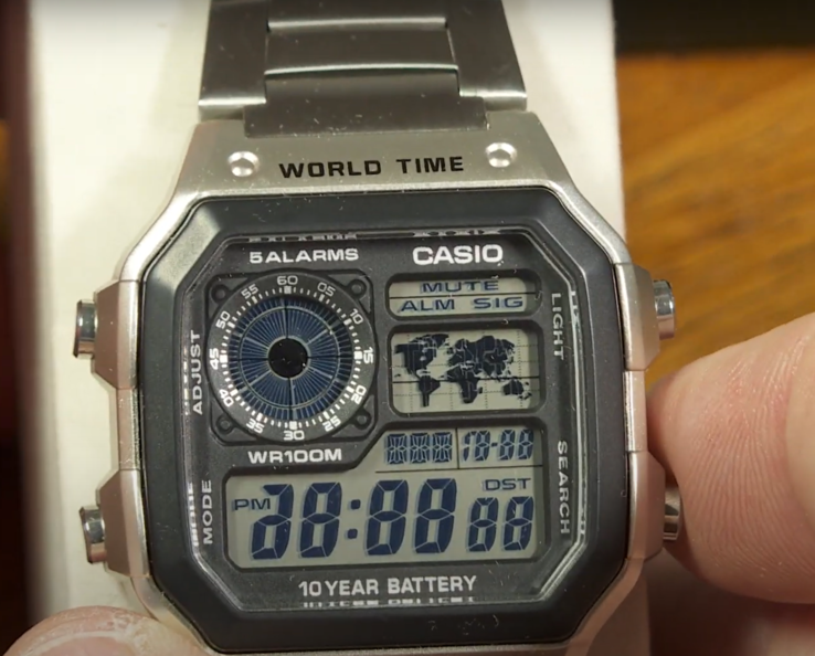 The Casio AE1200 series watches have a diagnostic mode that turns on when you press both buttons on the left and the lower-right button together. (Image source: Greg Anderson - The Good Timekeeper via YouTube)