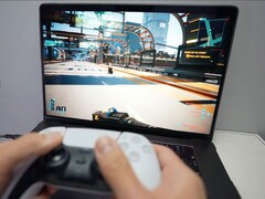 A person playing Cyberpunk 2077 on a MacBook using a DualSense controller, showcasing native gaming performance on macOS. (Image source: Andrew Tsai / YouTube)
