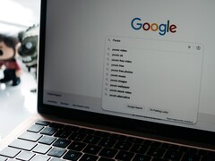 Laptop with an open browser window and the Google homepage on the screen