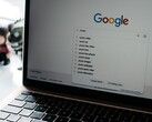 Laptop with an open browser window and the Google homepage on the screen