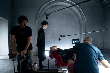 On set between takes, Tom Sturridge (Dream) prepares for another emotionally charged scene amidst a moody, gothic setting.