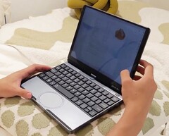 Torsin features a compact chassis with an unconventional round trackpad. (Image source: Torsin)