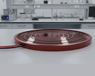 A conceptual image of a circular solar panel on a laboratory table (Image source: AI-generated image)