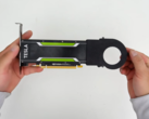 YouTuber holding the Nvidia Tesla P4 card in their hands