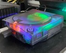 A picture of a modified SEGA Dreamcast with a translucent case in action
