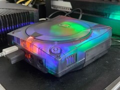 A picture of a modified SEGA Dreamcast with a translucent case in action