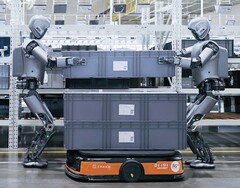 Two humanoid robots working on a factory floor (Image source: UBTech)