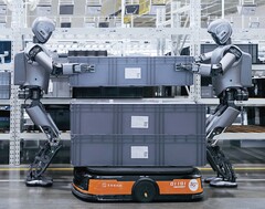 Two humanoid robots working on a factory floor (Image source: UBTech)