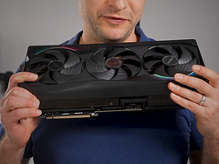 Alex Ziskind holding the RTX 5090 GPU.