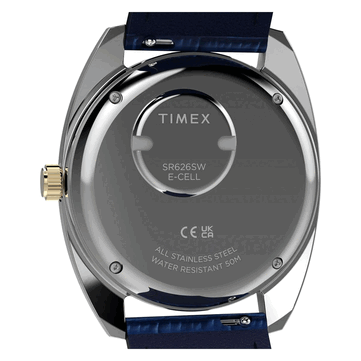 Rear view of the gold-tone Timex Q 1976 Day and Date, showing its stainless-steel caseback, battery compartment, and 50-meter water resistance marking.