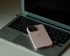An iPhone lying on the keyboard of an open MacBook Air