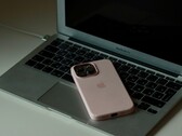 An iPhone lying on the keyboard of an open MacBook Air