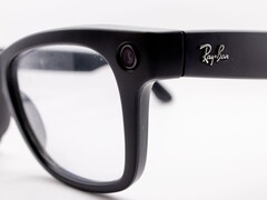 Close-up of black Ray-Ban Meta glasses with a camera lens in the frame