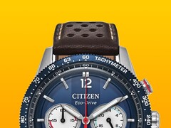 Close-up of the Citizen Racing Chronograph CA4716-09L, showing its blue tachymeter bezel, deep blue dial with silver-tone hands and markers, three subdials, red central seconds hand, and brown perforated leather strap against a yellow background.