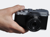 Fujifilm X-E4 compact interchangeable lens camera in hand